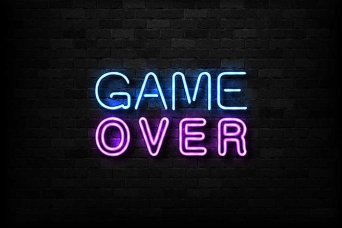 1197455563 featured image "Game Over" neon sign on brick wall.