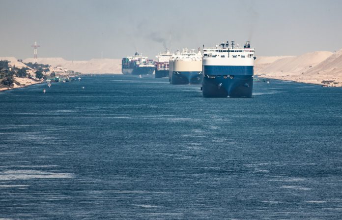 1282946971 featured image Multiple cargo ships in a narrow canal passage