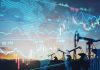 Oil pumps and financial charts against world map
