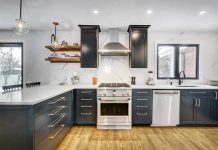 Modern kitchen with black cabinets and stainless appliances