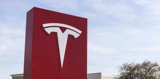 Tesla sign in front of dealership