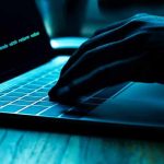Tech Giants KILL Passwords — Biometric Takeover Begins Hand typing on laptop with code on screen