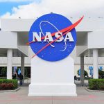 Moon Reactor RACE—NASA Plan Stuns Rivals NASA logo displayed prominently at a visitor center