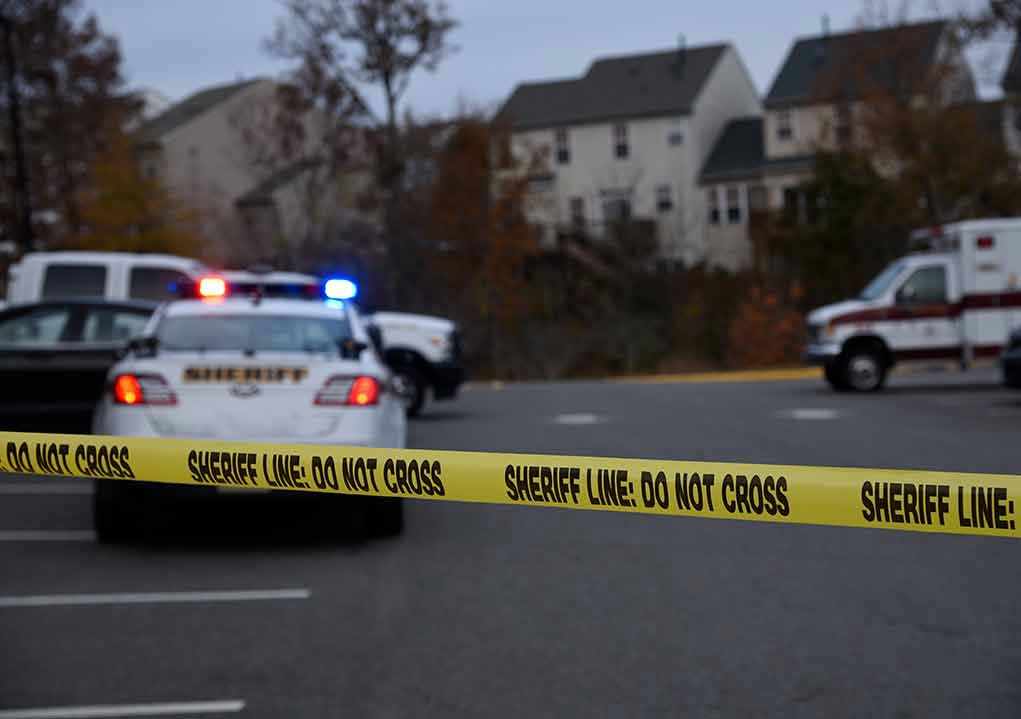 Suburban Nightmare: Teen Stuns Police With Plea! Sheriff line tape blocking scene with police and ambulance.