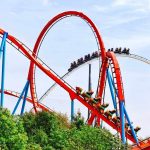 SHOCKING Death Rocks Universal’s Newest Coaster Colorful roller coaster with riders on a sunny day