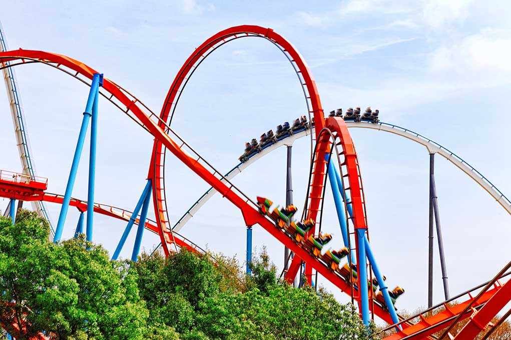 SHOCKING Death Rocks Universal’s Newest Coaster Colorful roller coaster with riders on a sunny day