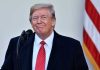 Trump CHARMS Leader – Secures Massive Deal! Man in suit and tie speaking at podium.