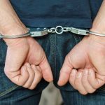 SERIAL Rapist Caught – College Campus ROCKED! Person in handcuffs behind their back.