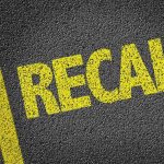 Automotive RECALL NIGHTMARE — Drivers Going Blind! Yellow RECALL text on asphalt background.
