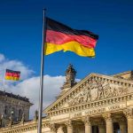 EXPLOSIVE THREAT Rocks Oktoberfest — Chaos in Munich! German flags at the Reichstag building in Berlin.