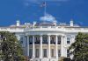 White House Shock: 3 Words Ignite Media Firestorm! The White House with the American flag flying against a blue sky