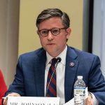 Congress MELTDOWN—Johnson Drops TRUTH BOMB! A public official speaking at a meeting with a nameplate in front of him