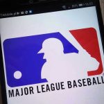 Baseball Scandal EXPLODES—Pitchers Under Federal Fire Major League Baseball logo on a smartphone screen.