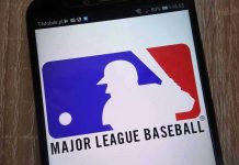 Major League Baseball logo on a smartphone screen.