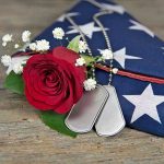 Cadets’ Shocking Murder Plot EXPOSED Dog tags, red rose, and folded American flag.