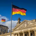 Conscription Returns – Germany Building Mega Army German flags at the Reichstag building in Berlin.