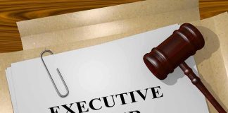 A gavel resting on a document labeled 'EXECUTIVE ORDER'