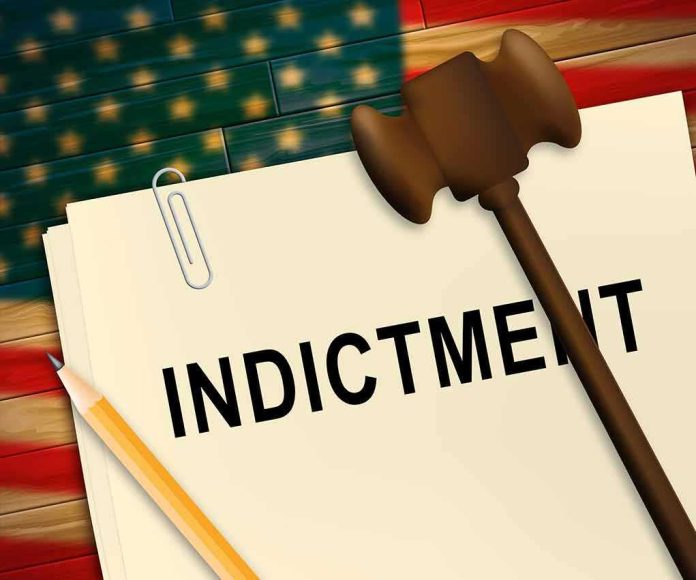 shutterstock_1435944215 (2).jpg A legal document labeled 'INDICTMENT' with a gavel and pencil