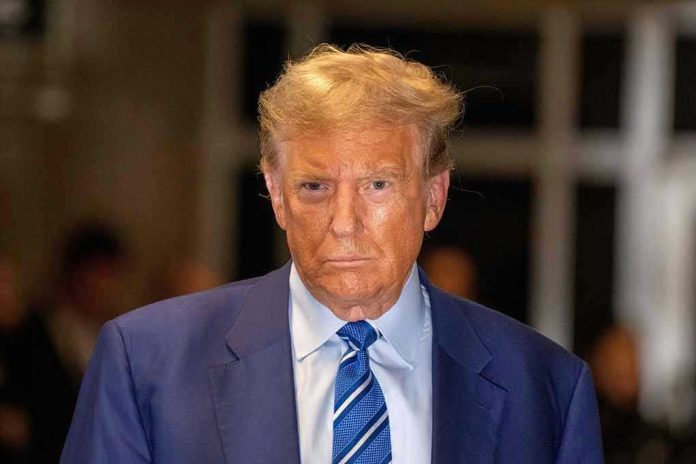 2490141757 Man in blue suit and striped tie, serious expression.