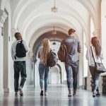 Texas Tech CRACKS DOWN on Race and Gender Teaching Four students walking in a corridor together.