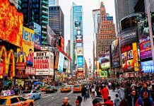 Celeb Attacks Worker in Times Square—Walks Free! Times Square crowded with people and bright electronic advertisements.