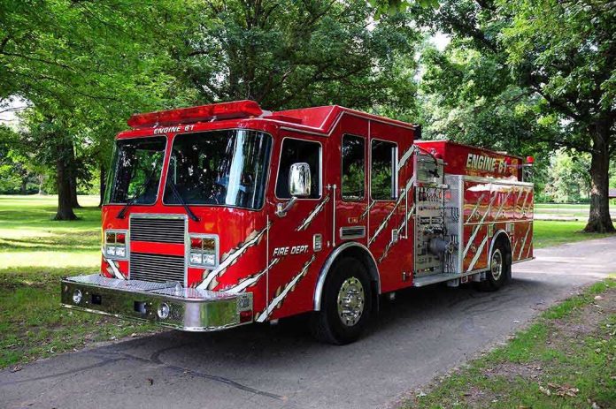 shutterstock_45954856.jpg A red fire truck parked in a green park