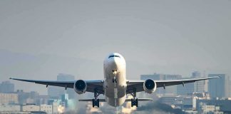 An airplane taking off from an airport runway