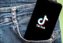 Newsom UNLEASHES Social Media Ban Phone with TikTok logo in jeans pocket.