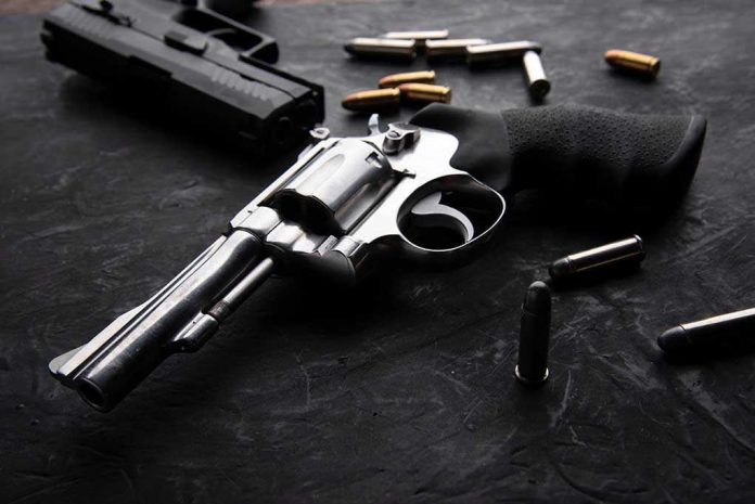 Revolvers and bullets on a dark surface.