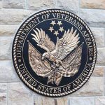 Bronze emblem of the Department of Veterans Affairs featuring an eagle and stars