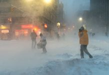 Refugee ABANDONED at Frozen Doughnut Shop — DEAD People walking in a snowy urban street during a blizzard