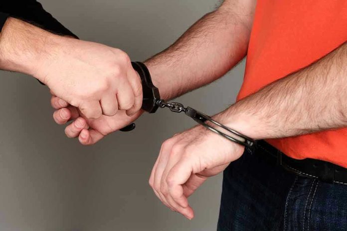 Person handcuffing another persons wrists