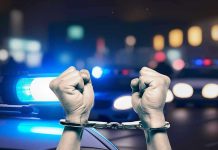 Routine DUI Stop Becomes FATAL Hands in handcuffs in front of police cars.
