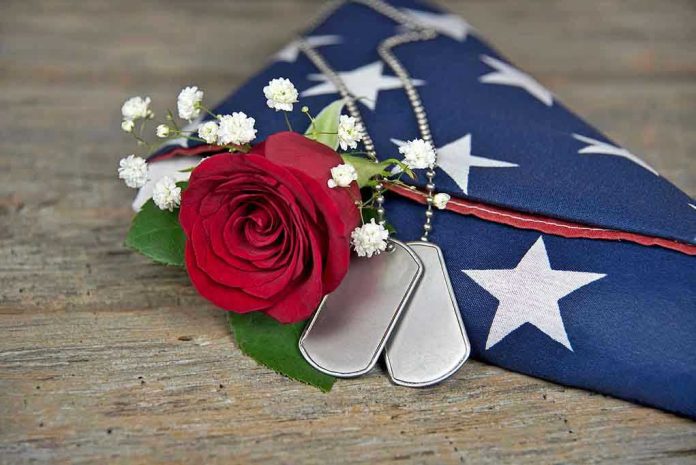 Dog tags, red rose, and folded American flag.