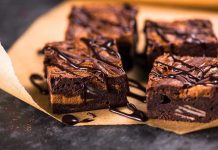 Scientists Uncover Heart HEALTHY Treat Chocolate brownies with drizzled chocolate on parchment paper.
