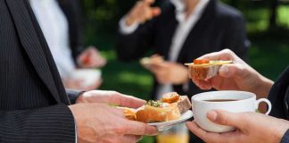 Professionals enjoying refreshments at an outdoor event
