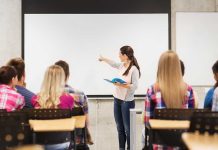 A teacher presenting to students in a classroom