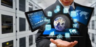 Businessman holding virtual data and analytics hologram.