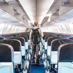 Drone SMASHES Jetliner—Feds Downplay IT! Person walking down empty airplane aisle