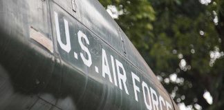 U.S. Air Force plane with trees in background.