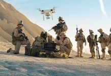 Pentagon’s AUDACIOUS $54.6B Drone Demand Soldiers operating a drone in a desert environment.