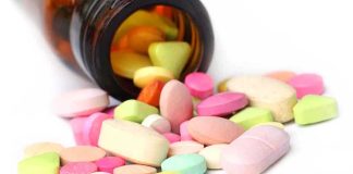 $270M HEIST Using Corner Store VITAMINS A variety of colorful pills and tablets spilled from a brown medicine bottle