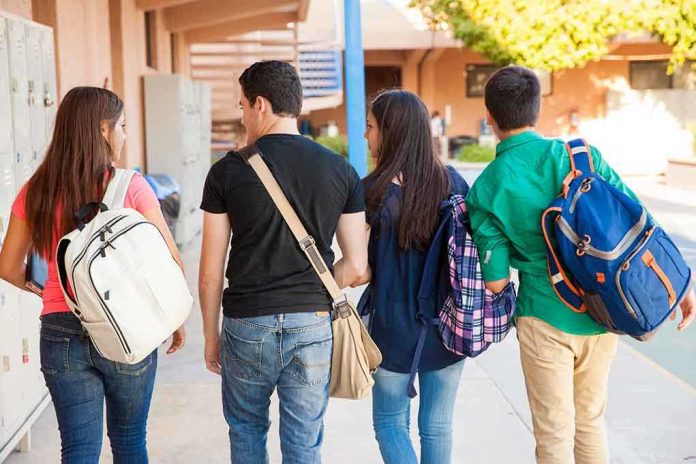 shutterstock_200190815.jpg Group of students walking together in a school corridor