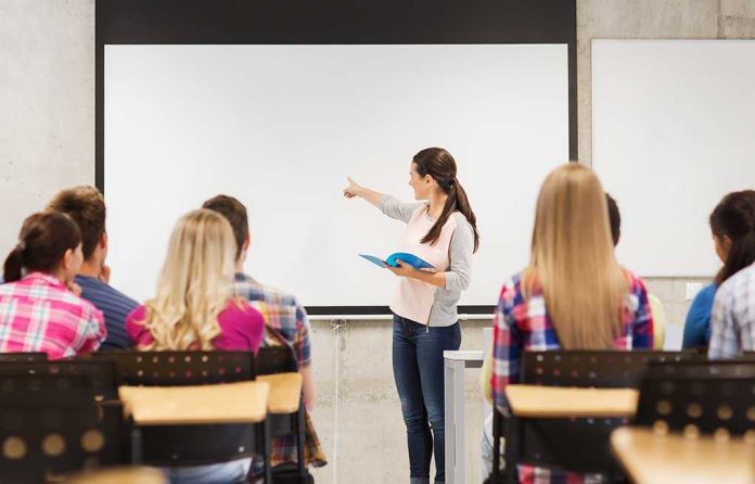 A teacher presenting to students in a classroom