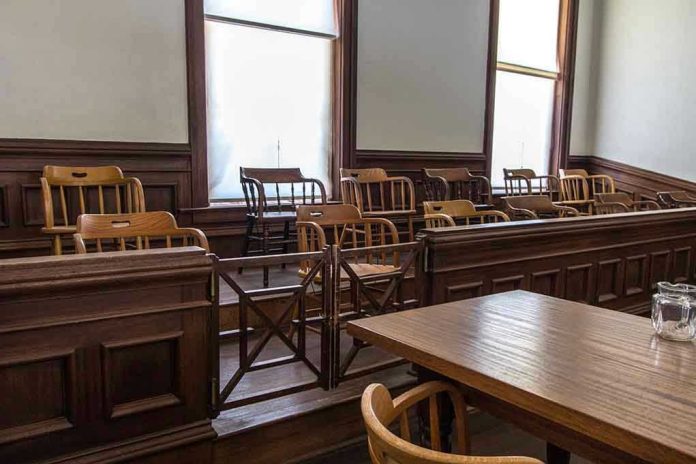 1403556146 Empty jury box and table in courtroom.
