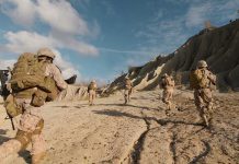 Ancient Fortress Seized – Northern Map Could Flip! Soldiers running on rocky terrain with backpacks.