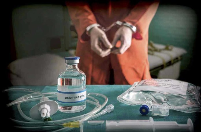 765745765-1 Vial labeled Sodium Thiopental near handcuffed person.