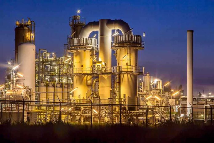 shutterstock_232641514 An industrial facility with illuminated structures at night