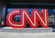 CNN Panel SPIRALS Over One Brutal Question Large red CNN sign outside building entrance.