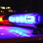 Masked Gunmen SNATCH Journalist From Home Police car lights flashing red and blue.